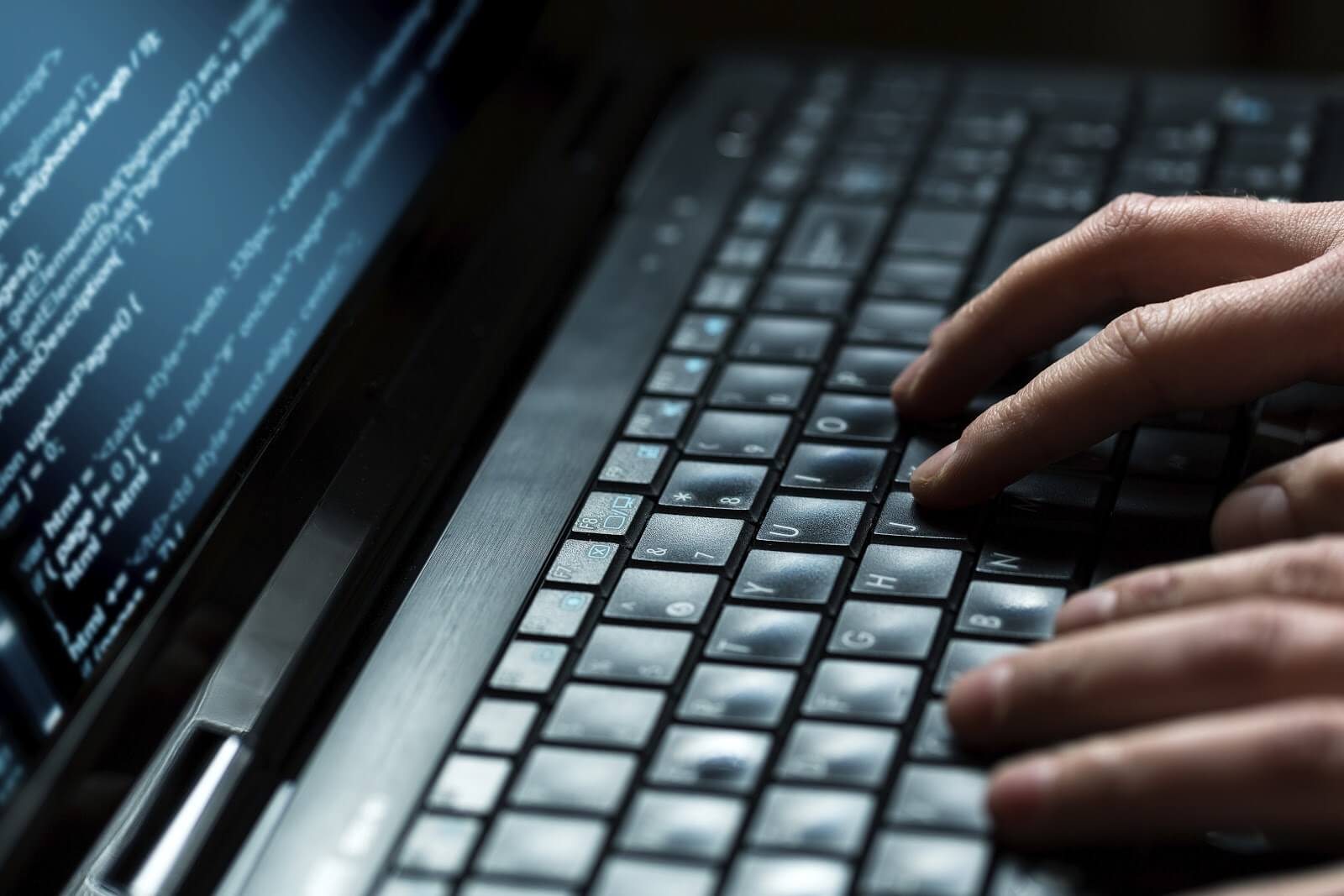 some hands typing on a keyboard