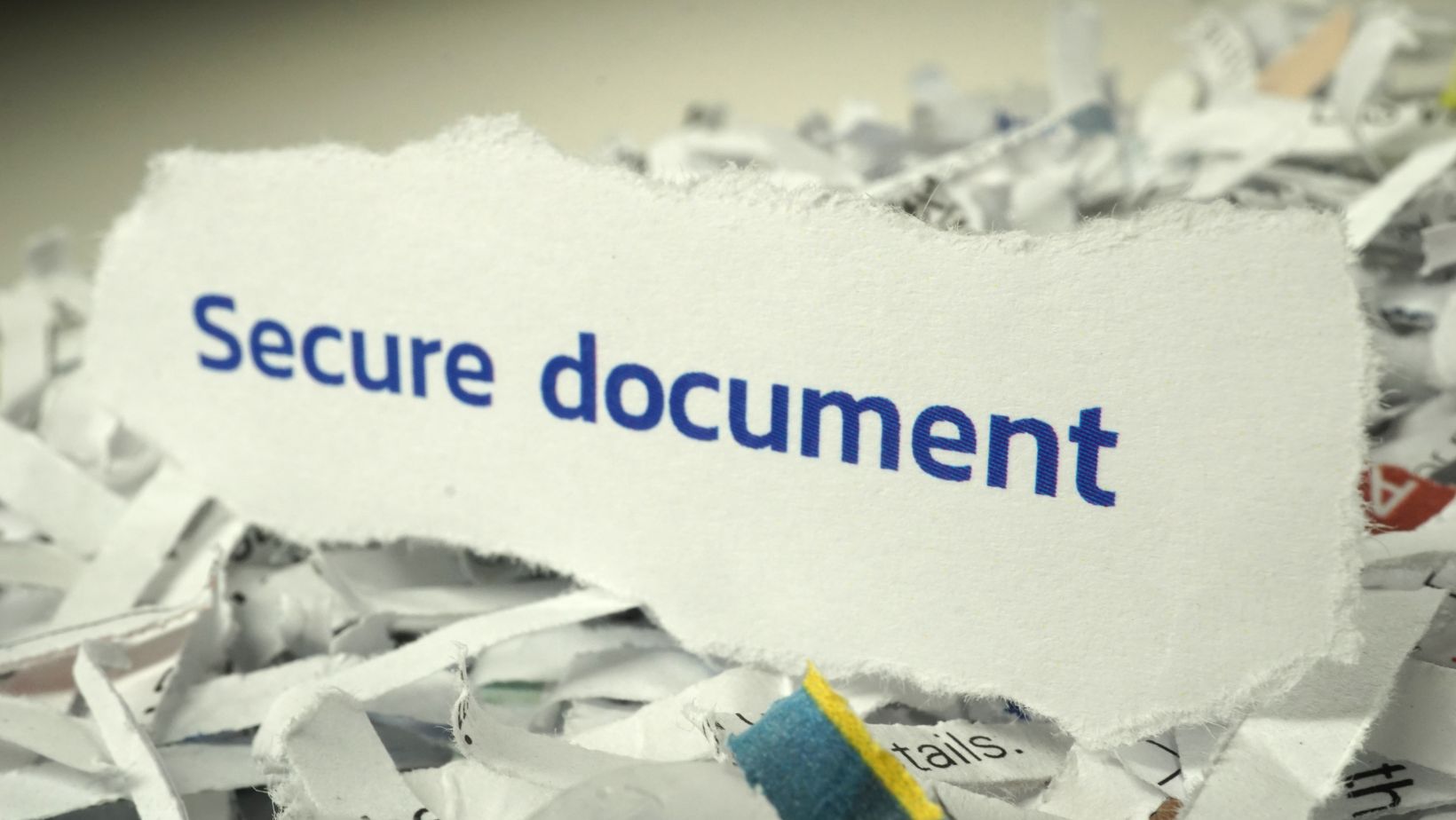 Shredded paper that says "Secure Document"