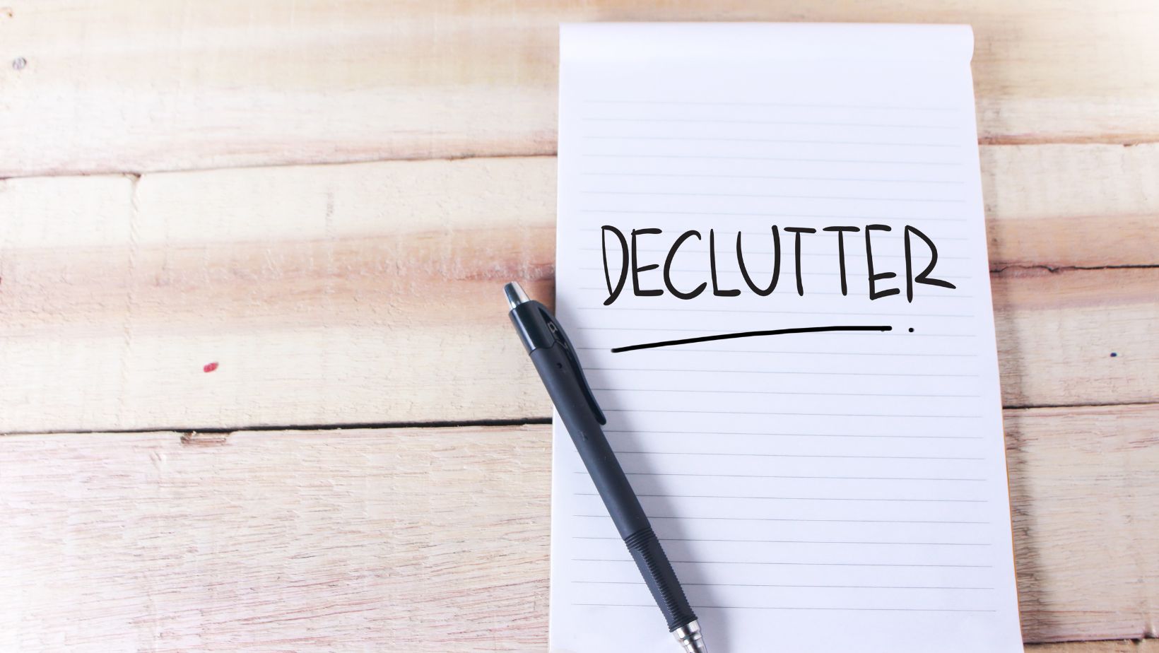 Piece of paper that says "Declutter"