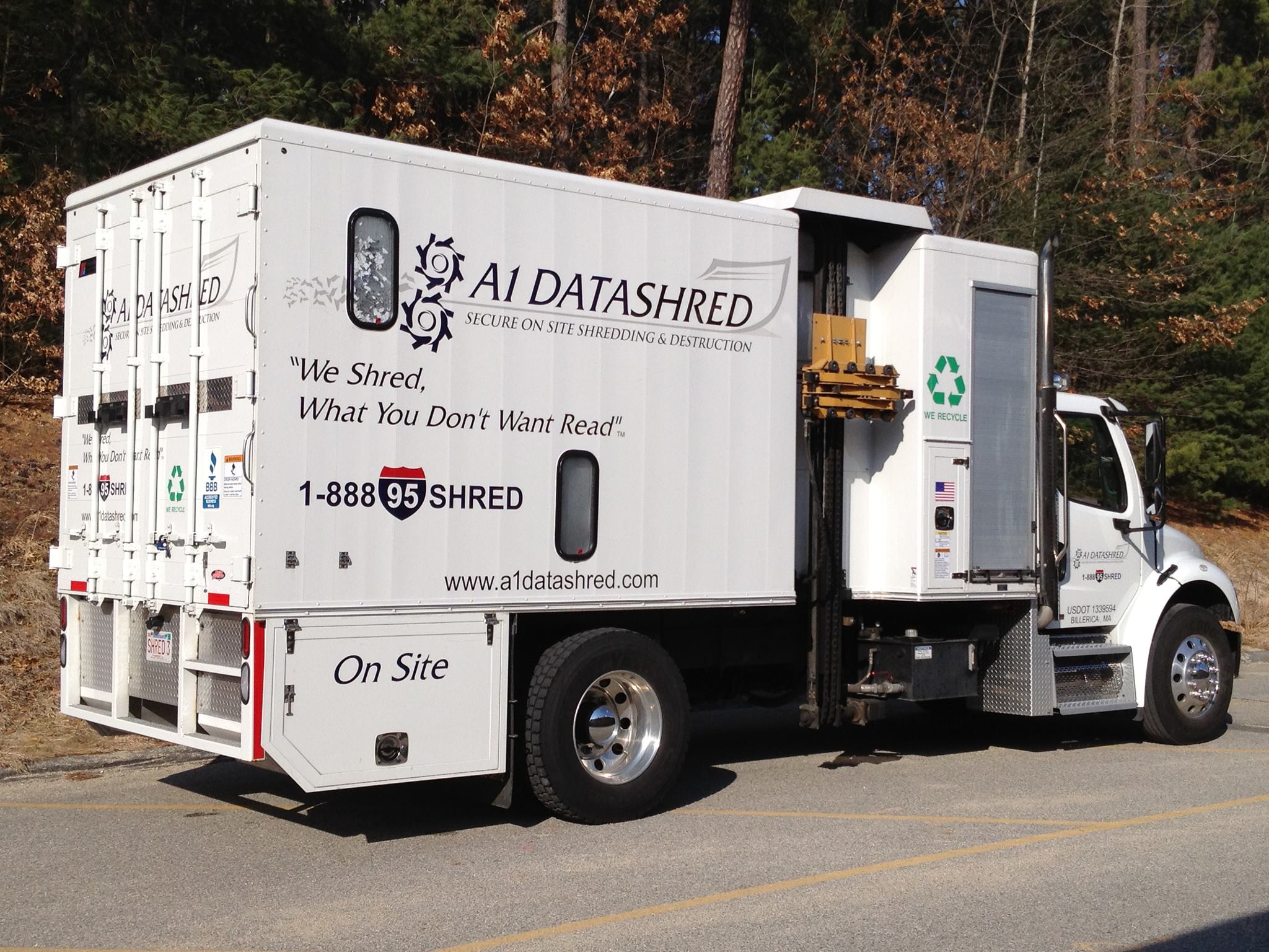 A1 Data Shred secure on-site document shredding truck with recycling logo parked on a road in Boston, MA